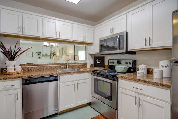 Kitchen with White cabinets at Heather Ridge Apartments, Michigan, 48185