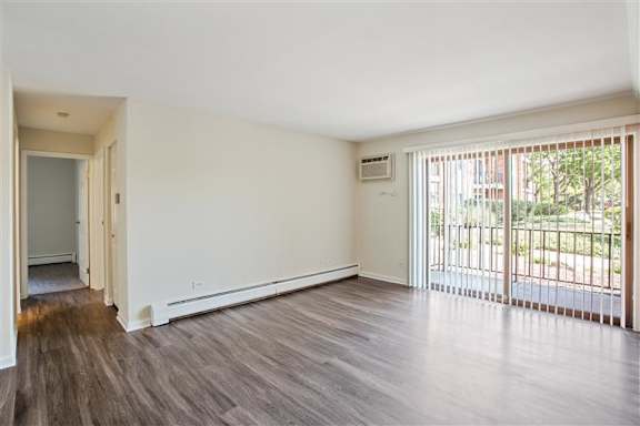 Empty living room at fifty9 Grove Apartments, Naperville, 60563