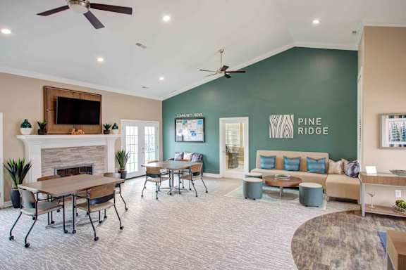 Living room with fireplace and couch at Pine Ridge Apartments, Rochester Hills, MI, 48307