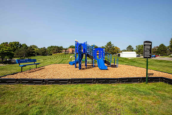 Blue slide in playground at Pine Ridge Apartments, Rochester Hills, 48307