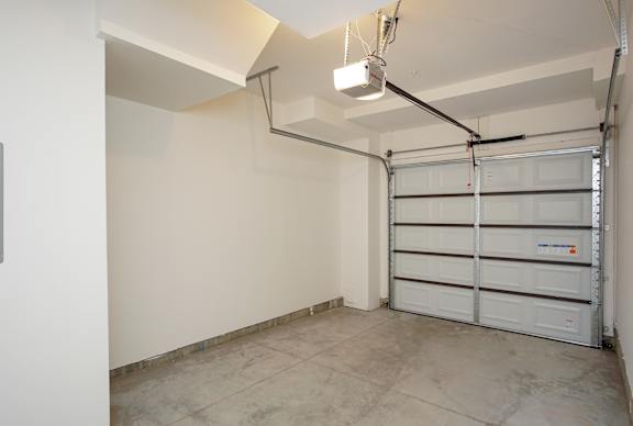Garage space with overhead door opener at Liberty Point Apartments, Draper, Utah