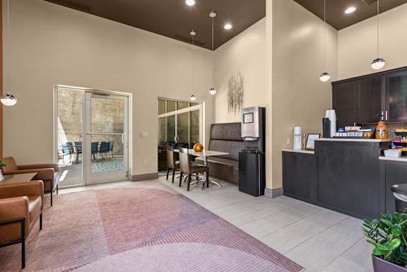 Leasing office lobby with seating and patio access at Liberty Gateway Apartments, Salt Lake City