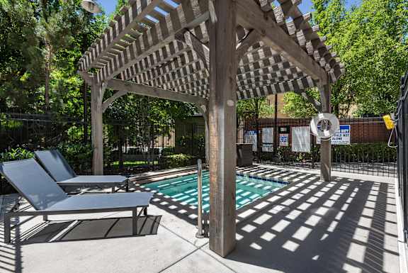 Pool deck with pergola and lounge chairs at Liberty Gateway Apartments, Salt Lake City, UT 84101