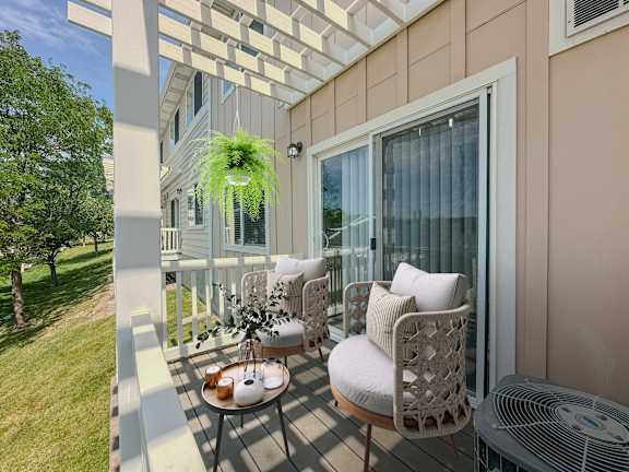 Private balcony with wicker chairs and pergola at Liberty Hill Apartments, Utah, 84020
