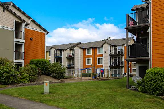 A sunny day at a residential complex with a clear blue sky.