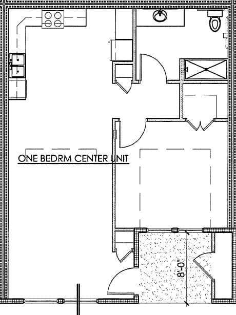 A floor plan of a one bedroom center unit with a kitchen area.