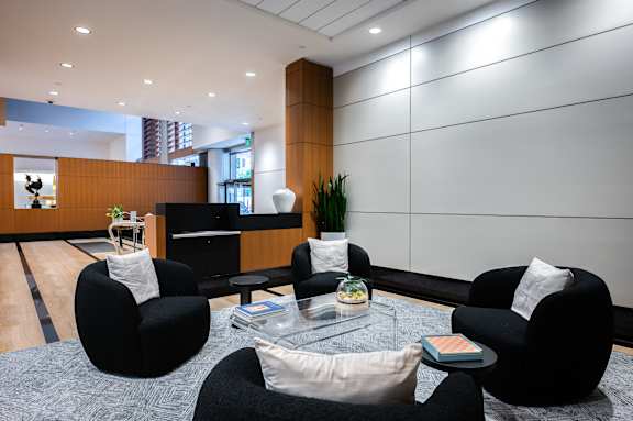 A modern living room with black and white decor.