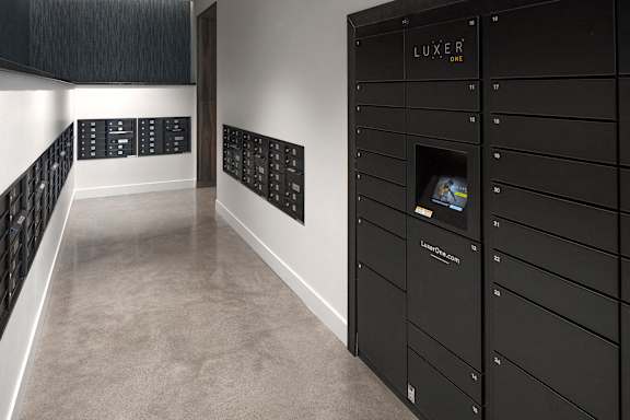 A black wall with the word "LUXER" written on it.