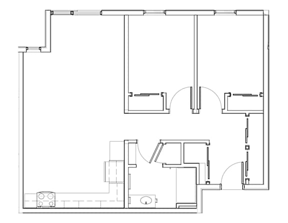 A black and white floor plan of a house with a kitchen, living room, and bathroom.