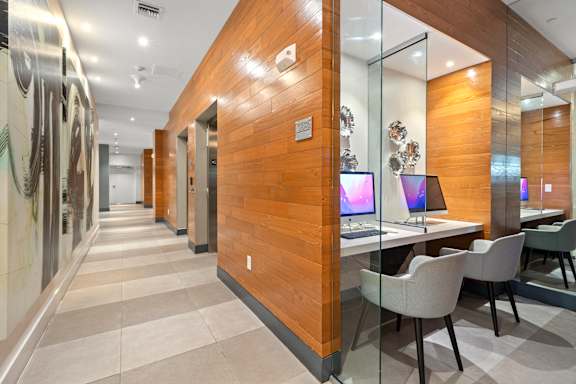 A modern office with wood paneling and glass walls.