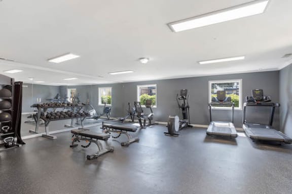 spacious fitness center with strength and cardio equipment