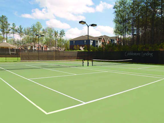 A tennis court with a net and a sign that says