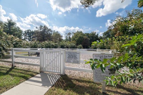 white gate leading into dog park