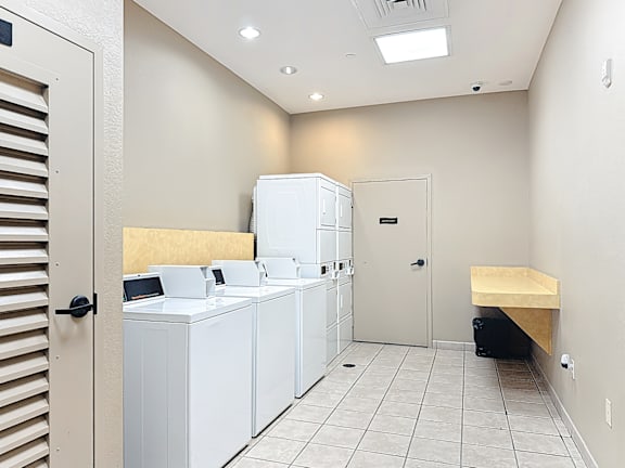 a laundry center with washers and dryers