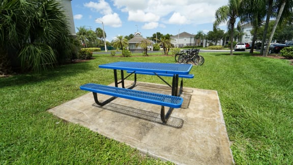 Outdoor picnic area surrounded by native landscaping