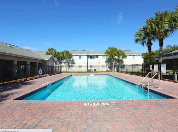 A swimming pool with the number 5 on the ground.