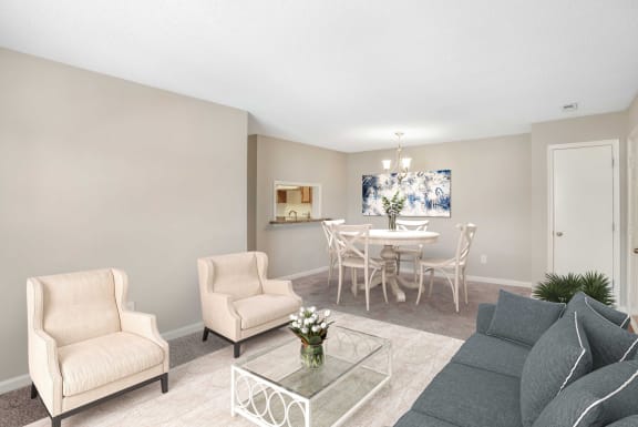 Living room with virtual sofa and arm chairs with a coffee table, Dining room in the background