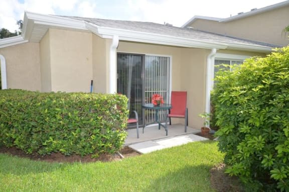 Patio Sitting Table Chair at River Park Place Apartments, Vero Beach, Florida