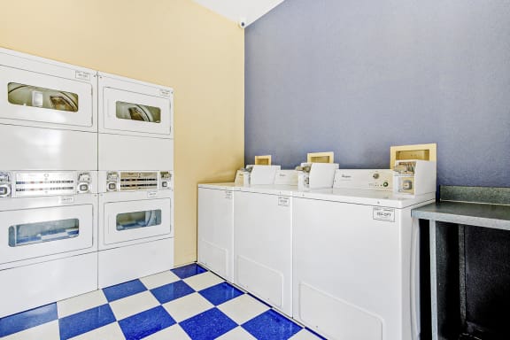 Laundry Center with washers and dryers and blue and white checkered floor