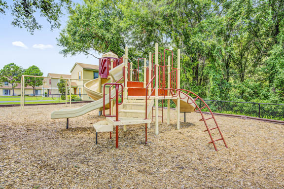 Playground with a jungle gym. swing set and multiple slides