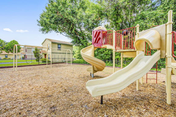 Playground with a jungle gym. swing set and multiple slides