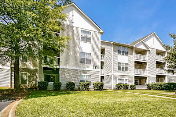 Apartment building with a blue and beige exterior.