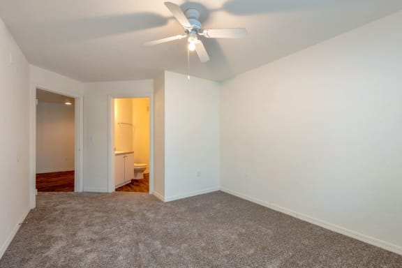 Carpeted Bedroom with Ceiling Fan and En-Suite Bathroom