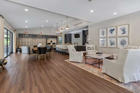 A modern living room with wooden floors and furniture.