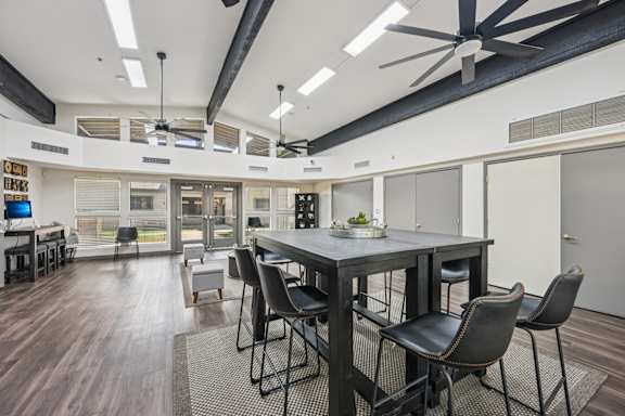 clubhouse with a large table and chairs.