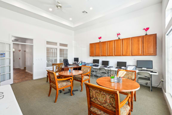 a room filled with furniture and a large window