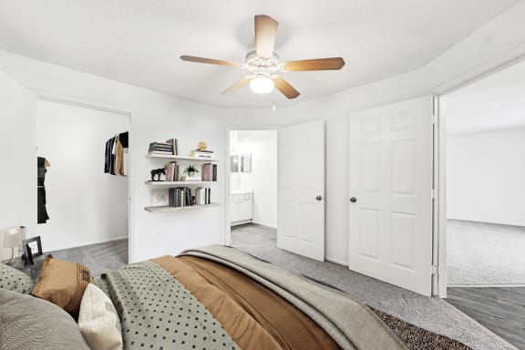 Bedroom bed facing en suite bathroom and closet