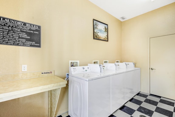 Indoor community coin laundry room with folding table