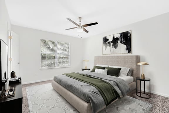 Bedroom With Ceiling Fan at Caveness Farms Apartments, Wake Forest North Carolina
