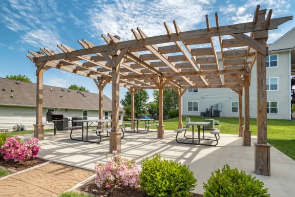 Grill area by a picnic table the grill area next to the apartment building