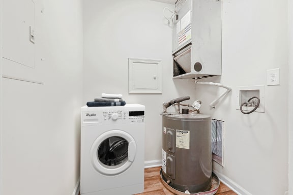 a small laundry room with a washing machine and a washer and dryer