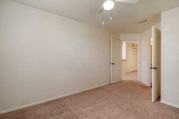 Bedroom with carpet flooring and multi speed ceiling fan