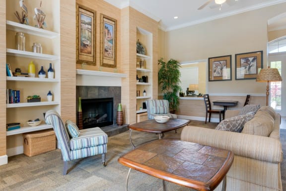 Club house lounge with couches, coffee table and rug
