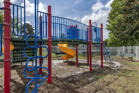 Outdoor Playground equipped with a slide, monkey bars, and latter