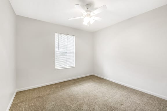 Bedroom with carpet flooring and multi speed ceiling fan