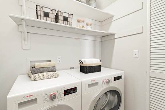 a laundry room with a washer and dryer at Eastchester Ridge Apartments, North Carolina