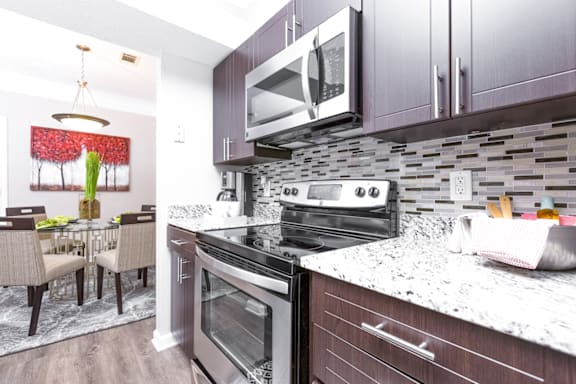 a kitchen and dining area in a 555 waverly unit