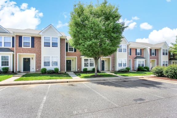 2 story Building exterior with green doors and shutters