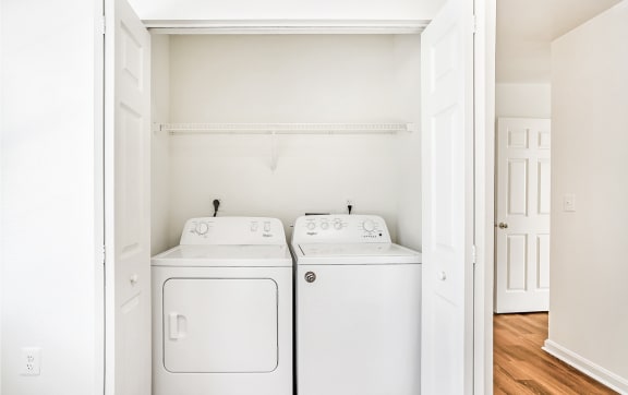 a laundry room with a washer and dryer