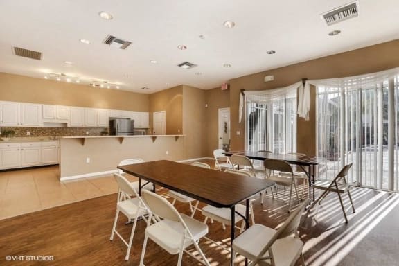 Clubhouse kitchen with tables and chairs