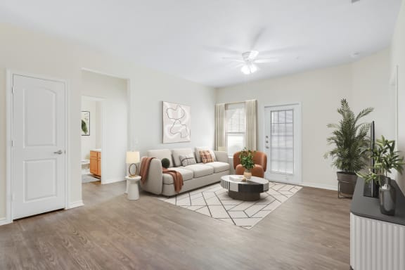 a living room with hardwood flooring