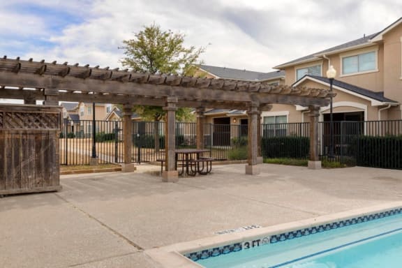 Swimming pool with tanning deck