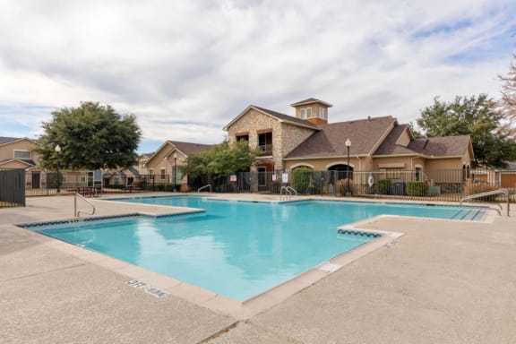 Swimming pool with tanning deck