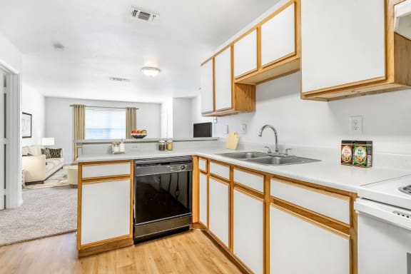 Kitchen with appliances and white countertops.