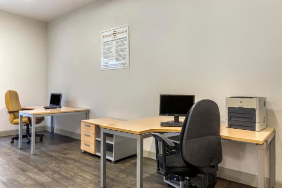Business Center with computers, desk, and chairs