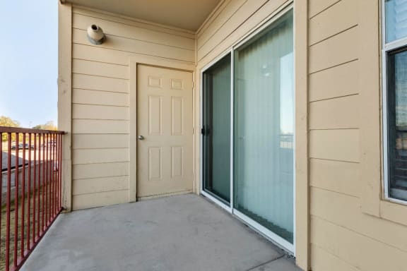 Balcony with storage door and sliding door
